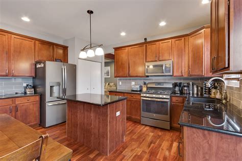 maple cabinets stainless steel appliances|dark maple kitchen cabinets.